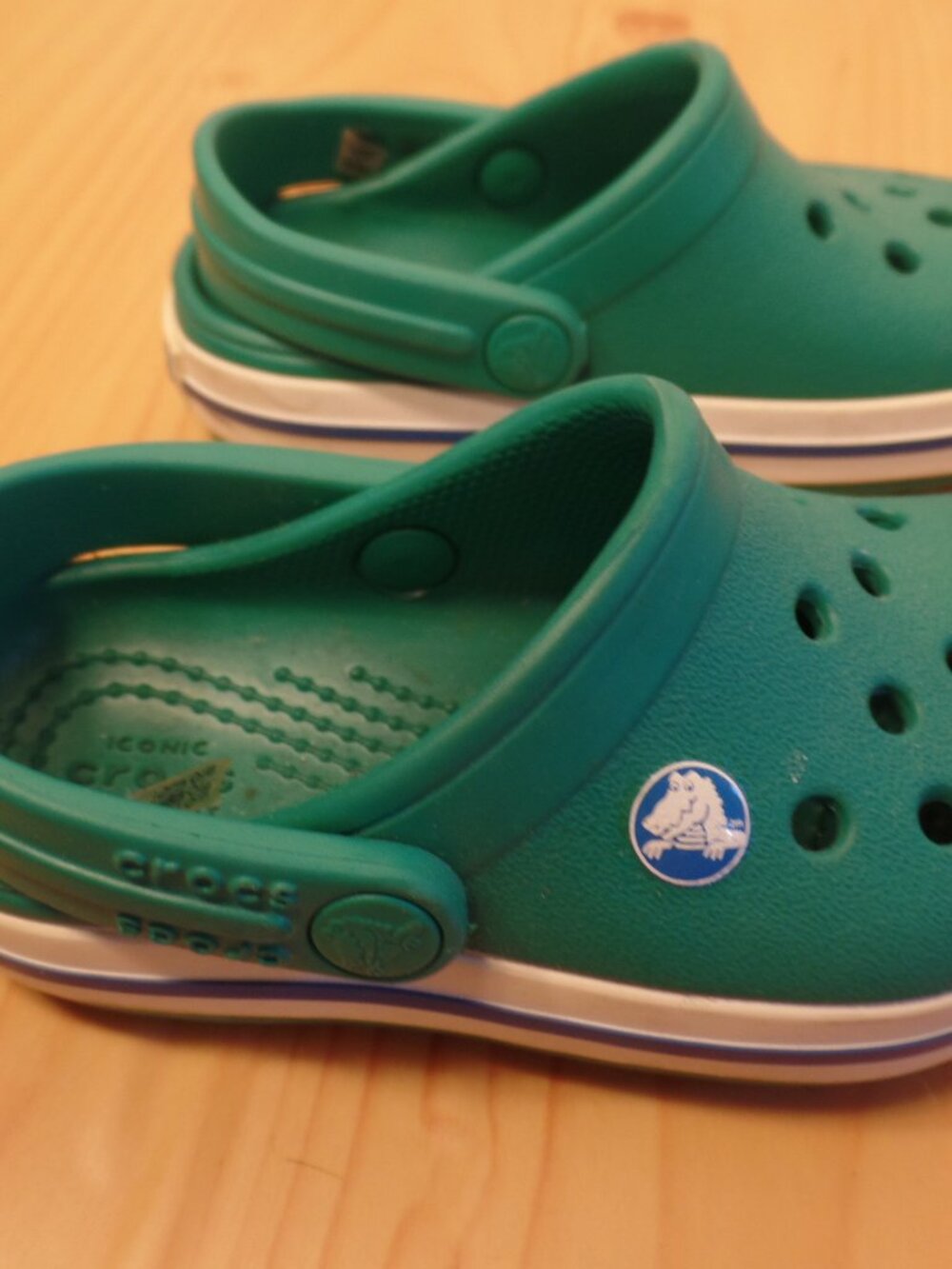 The Crocs Kids Crocband Clog Slip On Sandal in green and blue, size 6, is a ligh